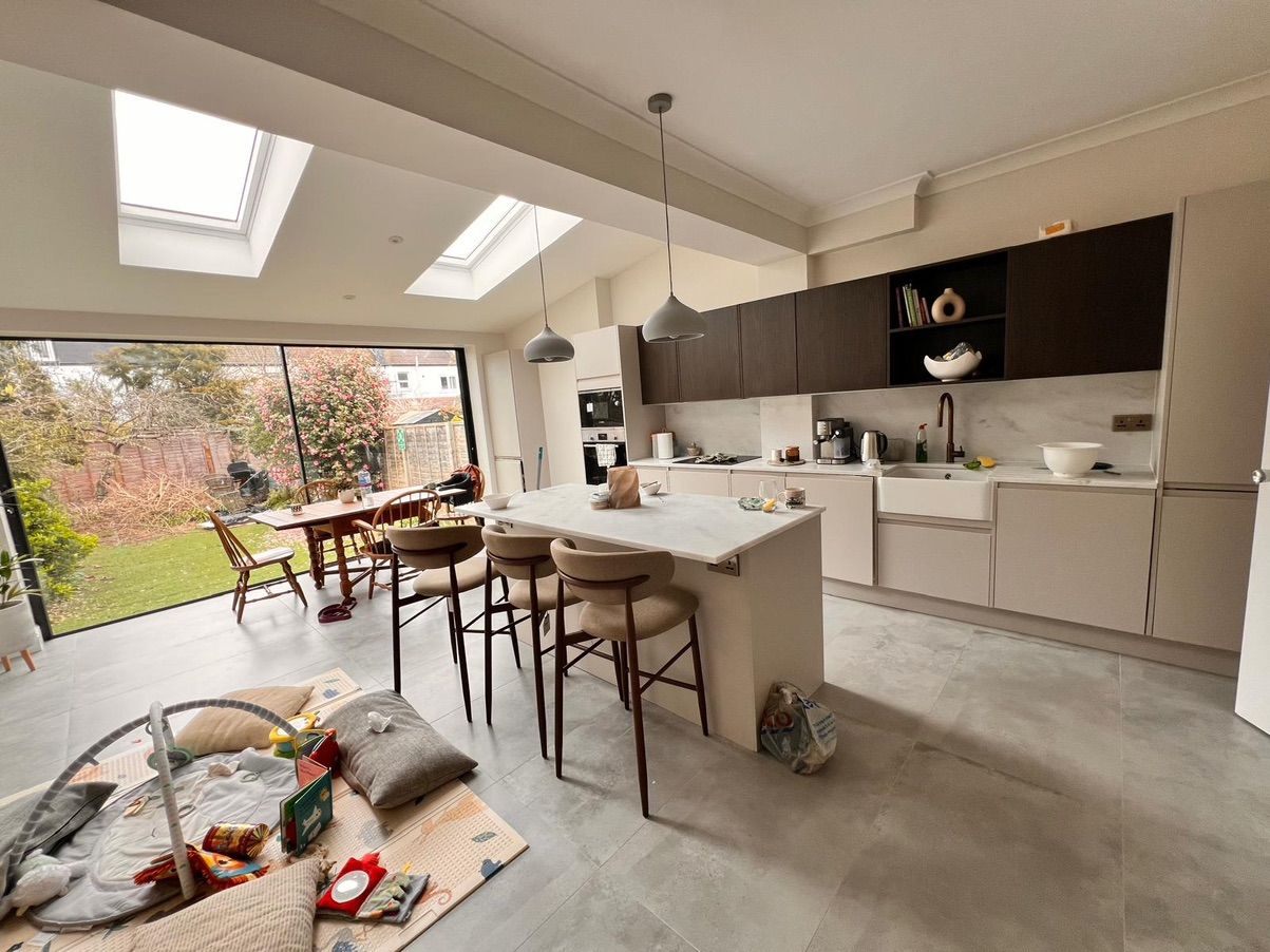 Modern open-plan kitchen and dining area showcasing functional zoning and efficient layout for multi-tenant properties
