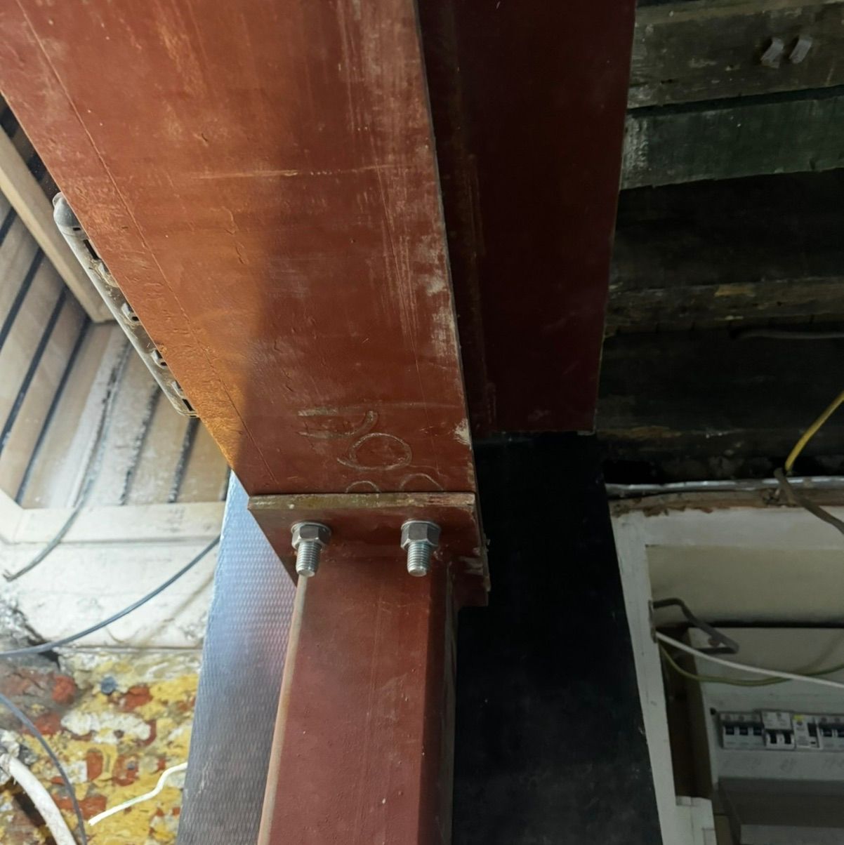 Close-up of a structural steel beam joint, illustrating the precision required in modern structural engineering to support new building technologies